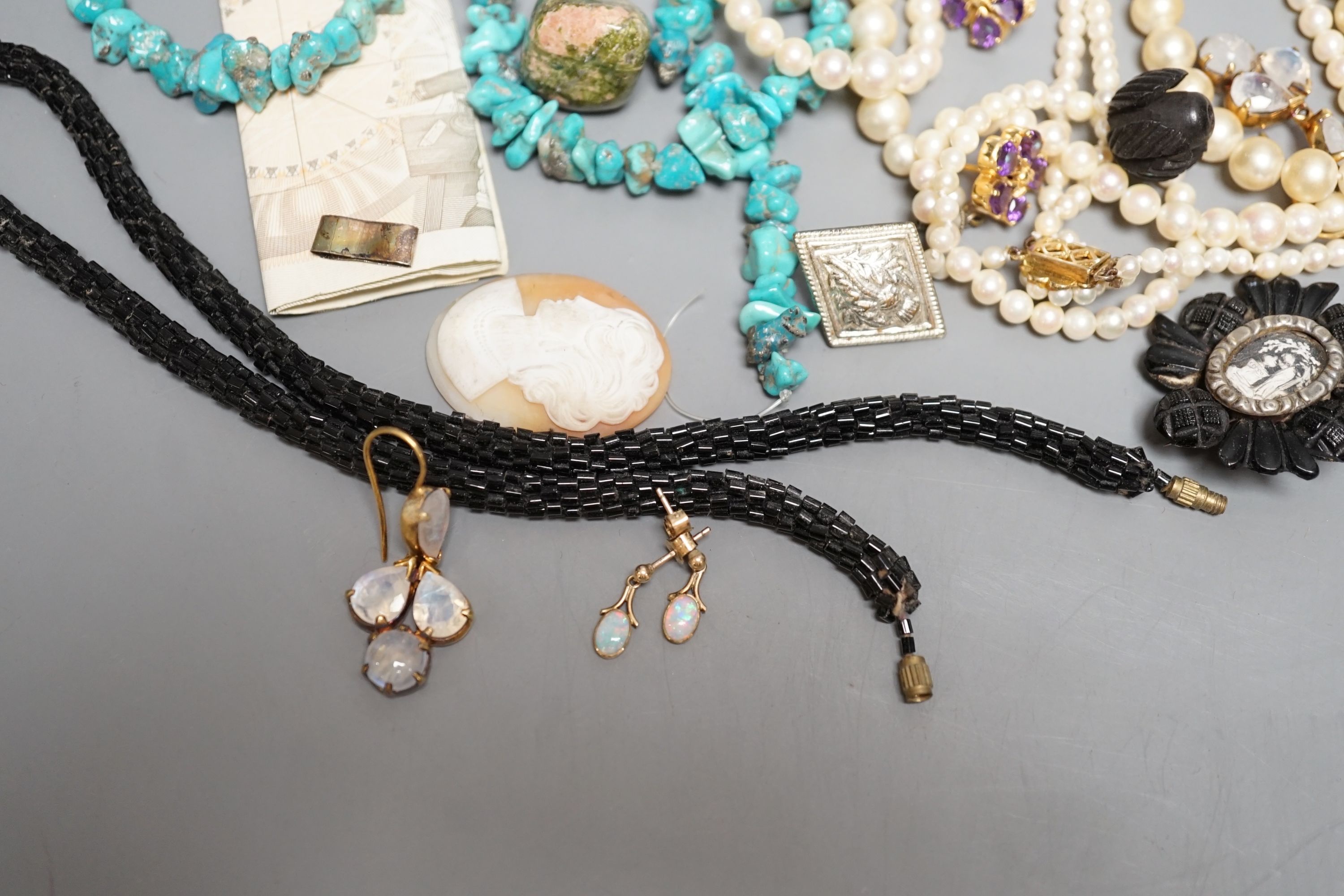 A quantity of costume jewellery including a pair of yellow metal and opal drop earrings.